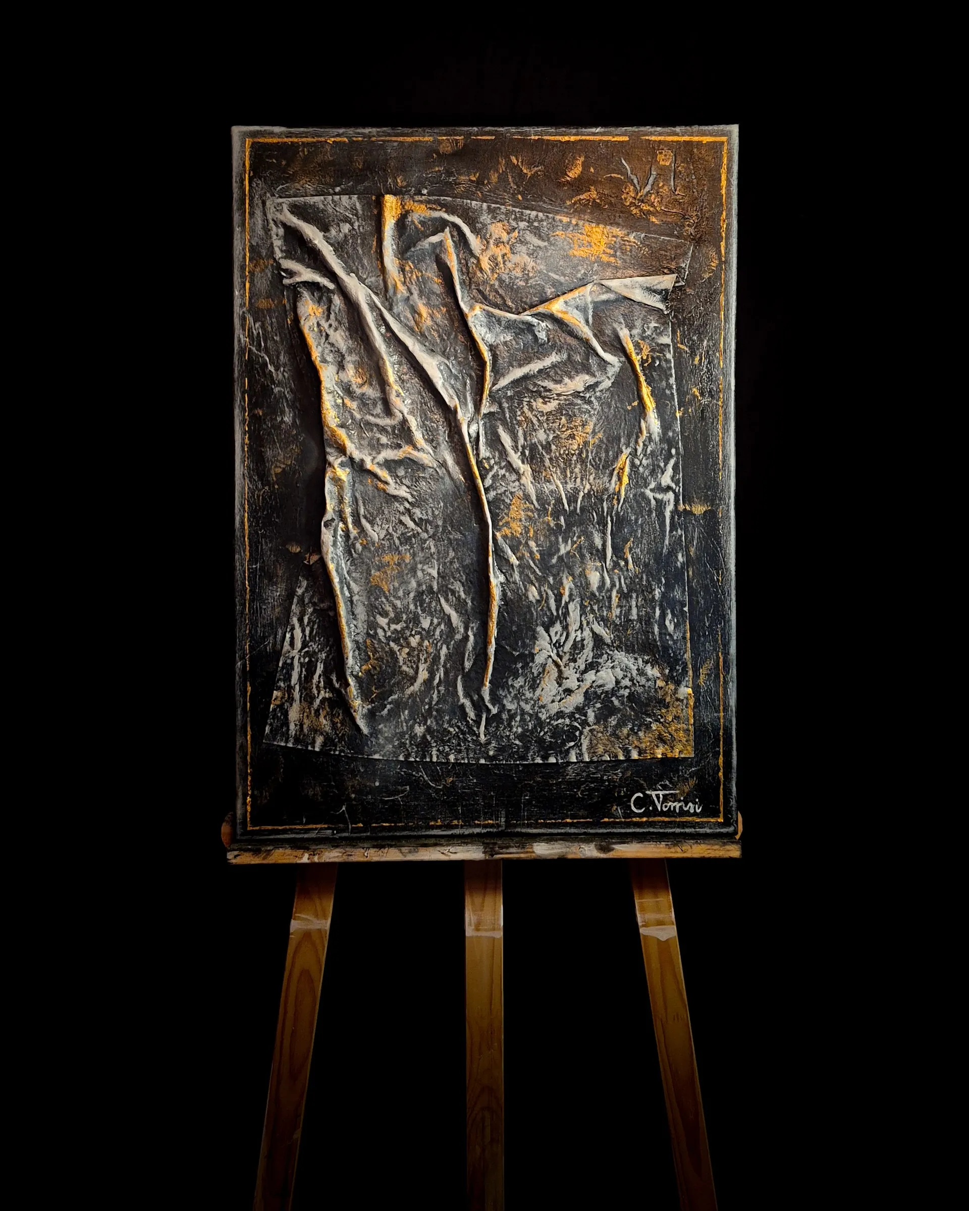 THE TOUCH, 2026 — acrylic on canvas shown on an easel against black: pale drapery forms over a dark gold ground